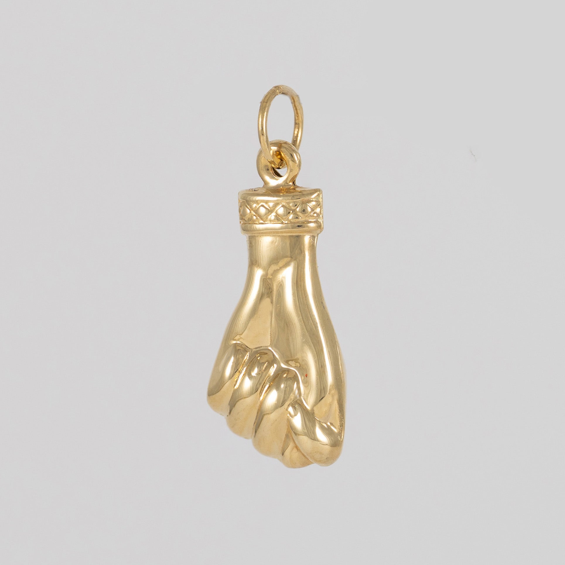 Colgante Puño oro 18k 750