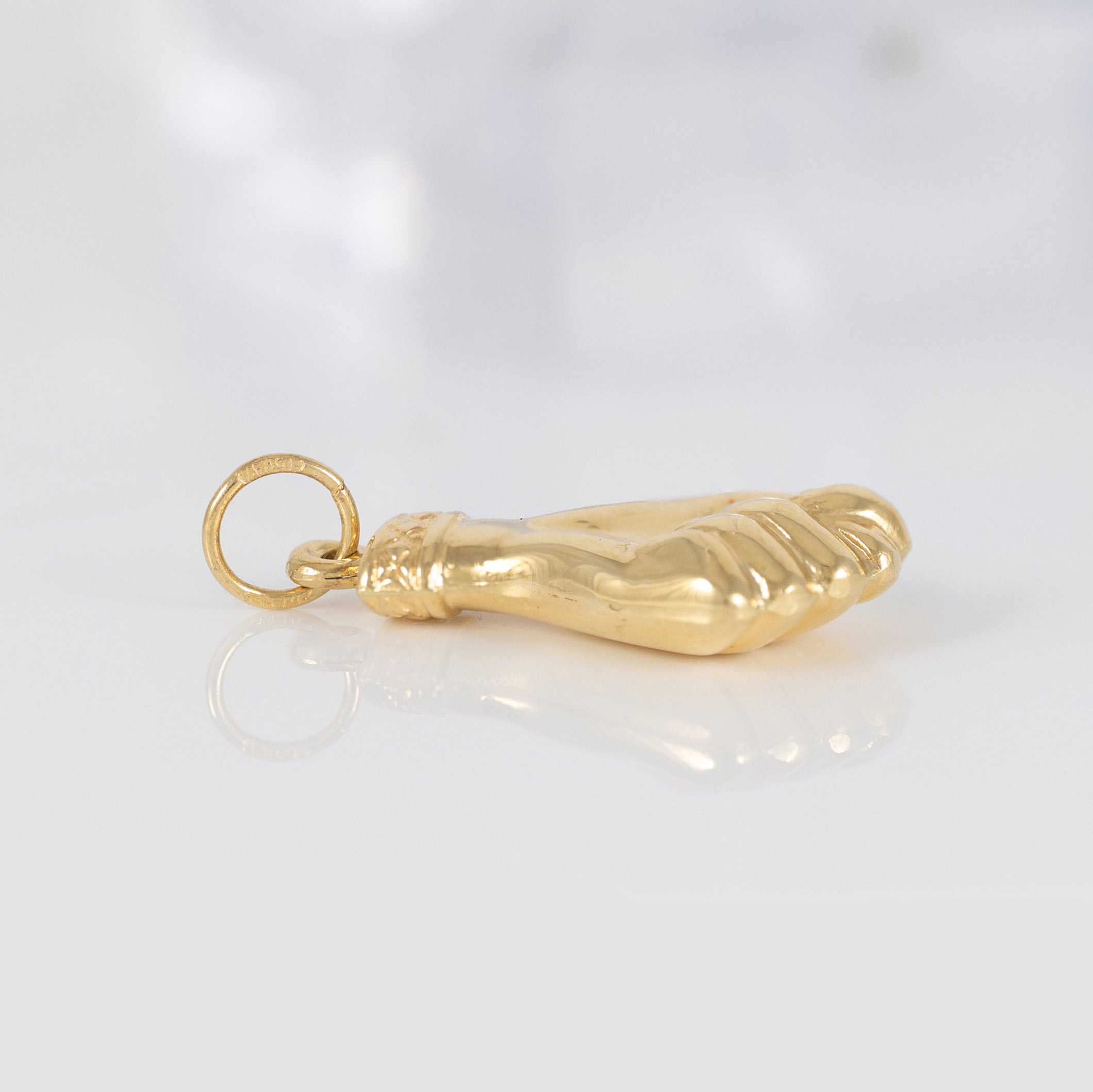 Colgante Puño oro 18k 750