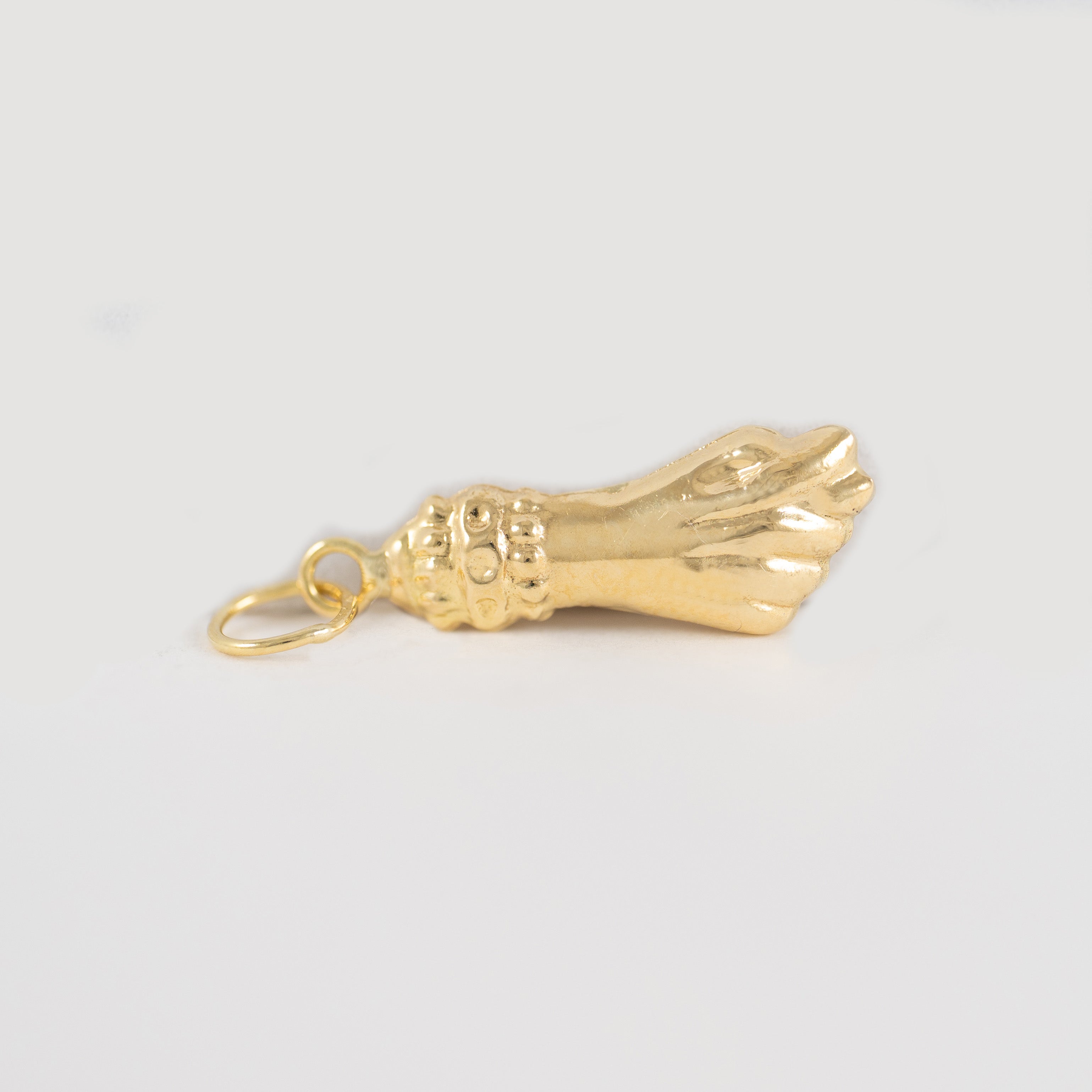 Colgante Puño oro 18k 750