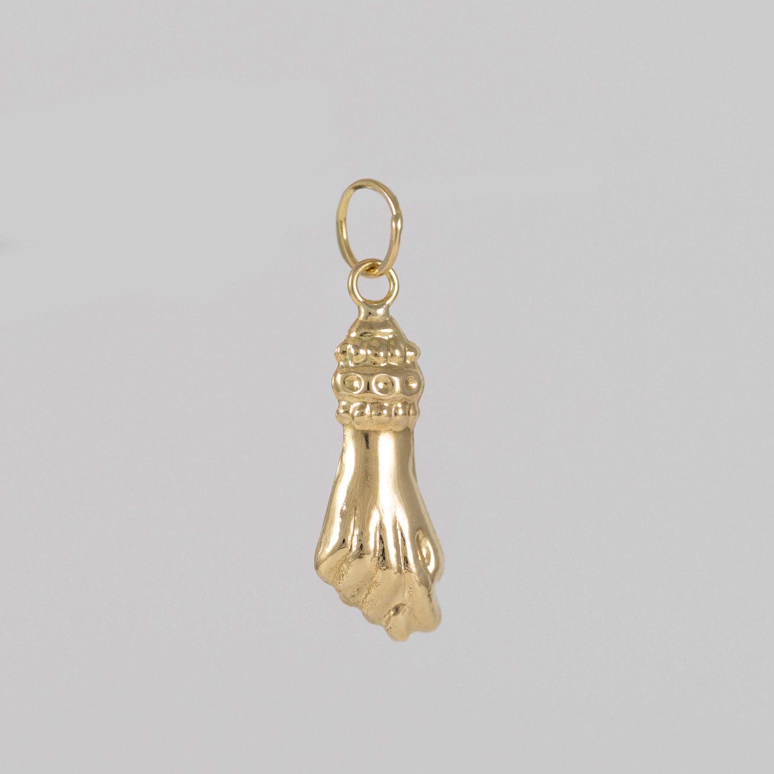 Colgante Puño oro 18k 750