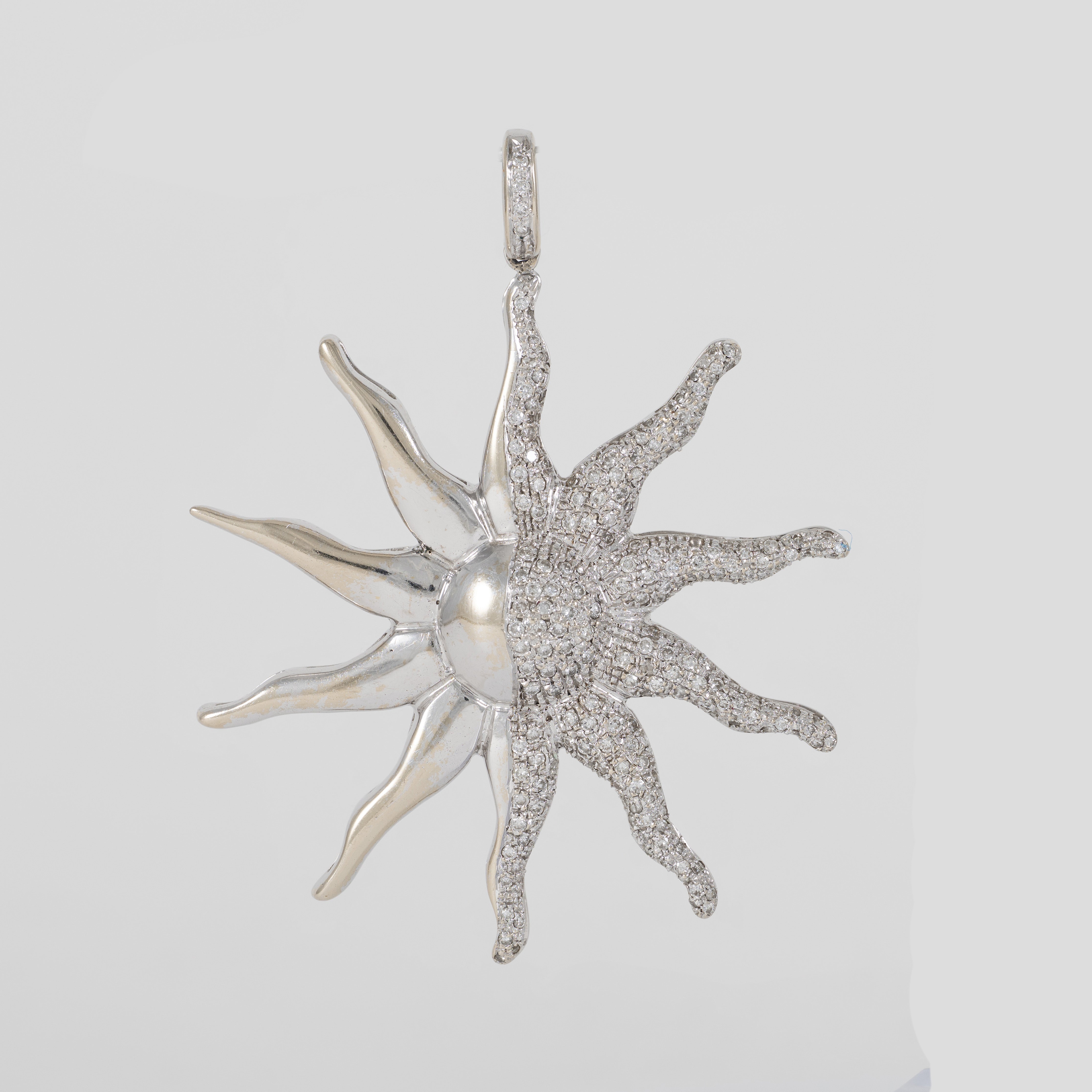 Colgante Sol de oro blanco 18k con brillantes