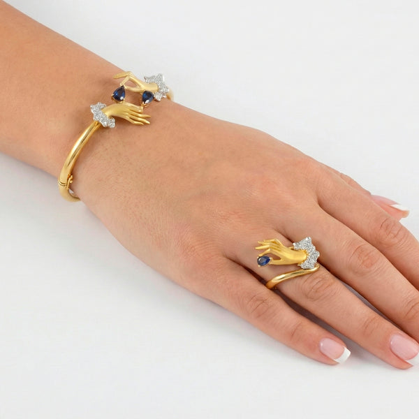 Conjunto Carrera y Carrera Pulsera y Anillo en oro amarillo y blanco 18k brillantes y zafiros