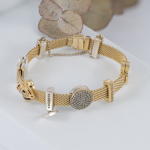 Pulsera Pandora Reflexions Plata con baño de oro 18k con Charms
